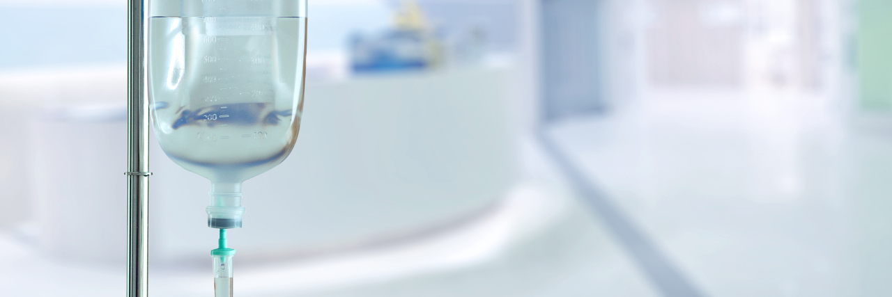 FDA Approves Zulresso, First Drug for Postpartum Depression saline bag and hospital blurry background