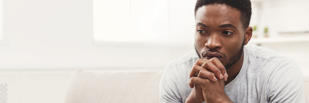 I Don’t Want to Do Anything — What’s Wrong With Me? Young african-american man sitting at home. Sad guy sitting on the couch , copy space