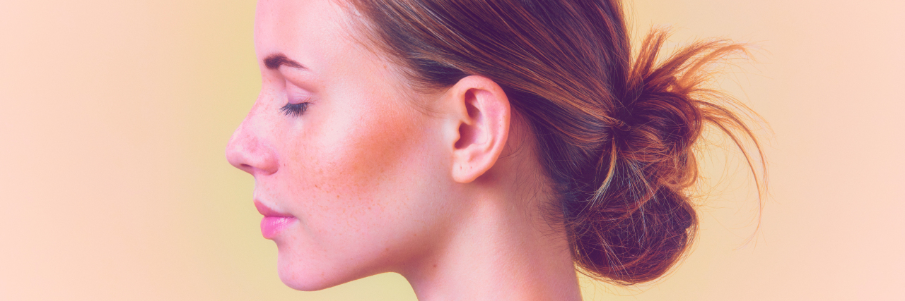 Adjusting to Vision Loss in One Eye Redhead woman with freckles. Her visible eye is closed.