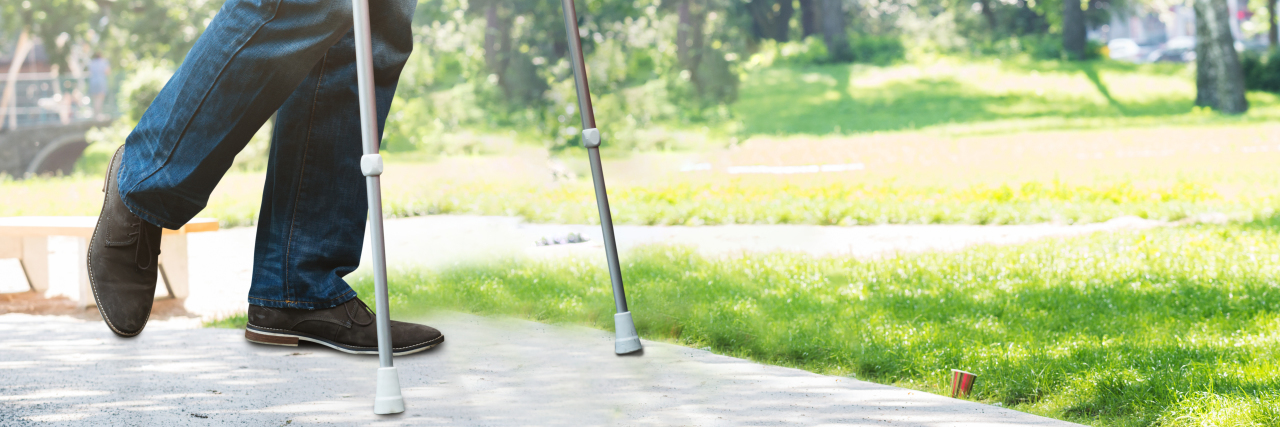 My Cerebral Palsy Is an Oxymoron Man Walking With Crutches In Park