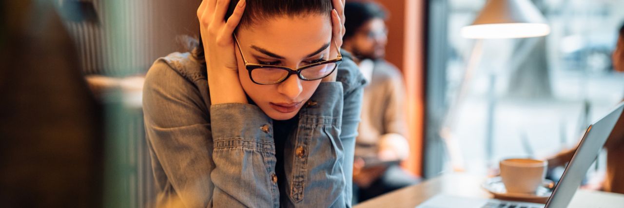 How the College Admissions Scandal Could Affect Students With Anxiety photo of young woman studying looking anxious and stressed