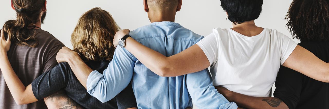 Finding Allies in the Fight for Autism Rights People with arms around each other in solidarity.