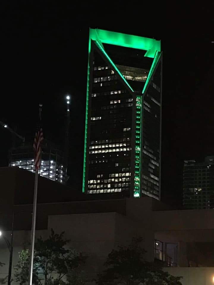 Building lit up green.