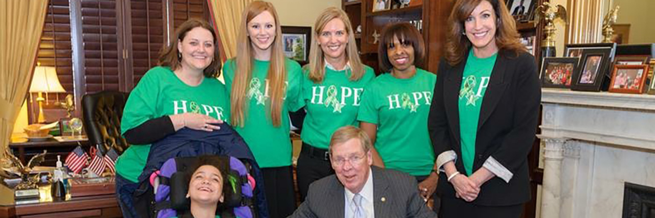 Cynthia with her daughter and RFTS volunteers at Senator Isakson's office getting Cerebral Palsy Awareness Day recognized in Washington.