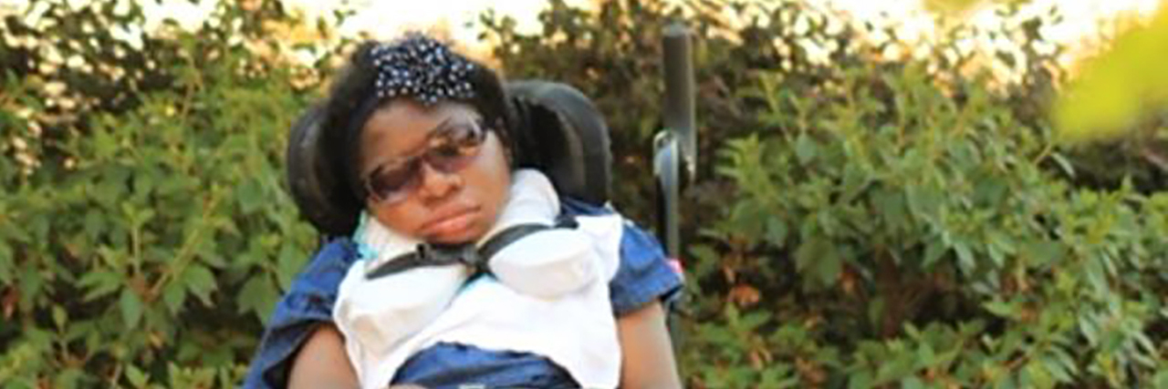 Cerebral Palsy Isn't a Sickness Kerstin sitting outside in her wheelchair.