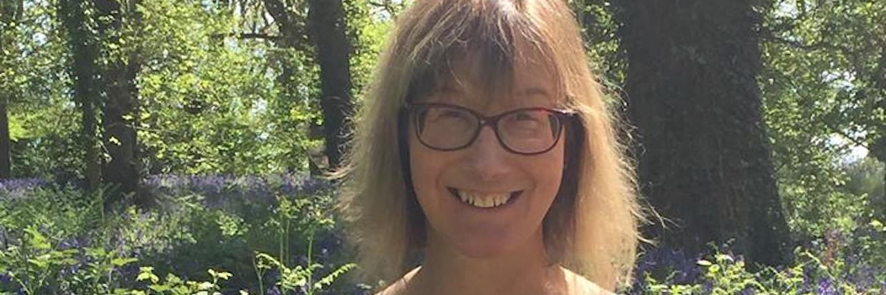 Letter to My Wife: You Are the Best Mom to Our Autistic Child Woman outdoors smiling at camera