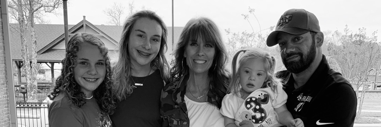 What World Down Syndrome Day Means to Me Savannah with her mom, dad and two sisters.