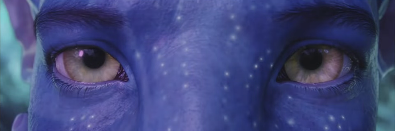 screenshot of movie avatar showing blue alien eyes
