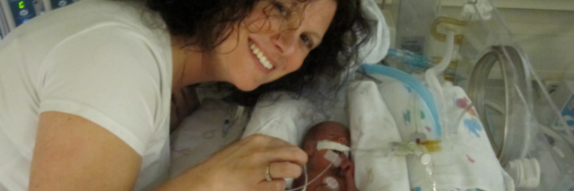 The author and her child as a tiny baby, lying in the hospital and connected with tubes