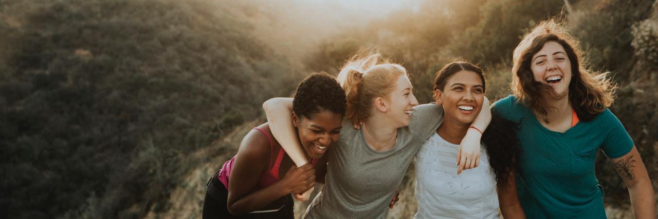 Why People With Type 1 and Type 2 Diabetes Shouldn't Be Divided four friends with arms around each other on a hike