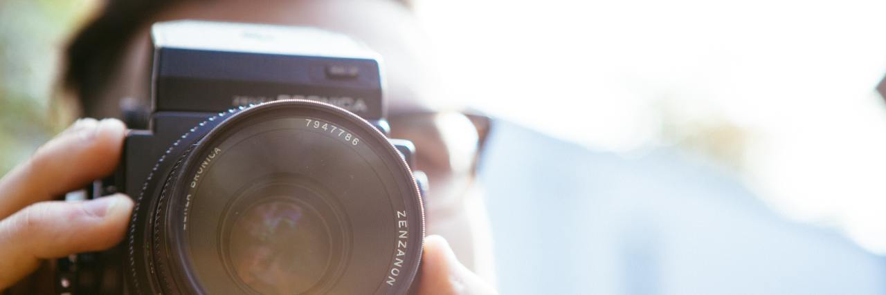 Behind the Scenes of 'Shake With Me' Film About My Mom's Parkinson's man holding camera up to eye