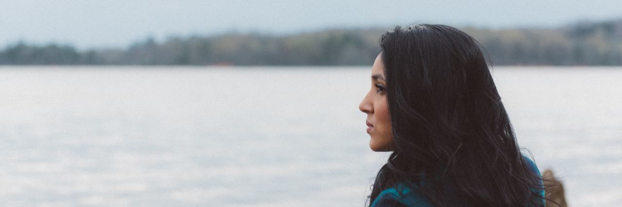 Habits People Might Have in Eating Disorder Recovery photo of dark haired woman looking out to sea