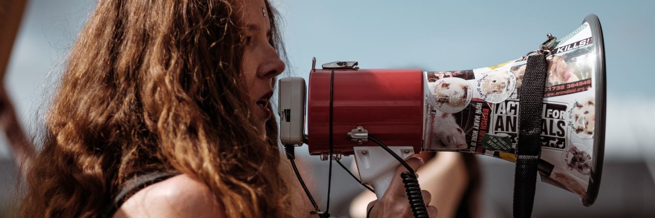 Finding My Voice Through Sexual Assault woman with megaphone at event