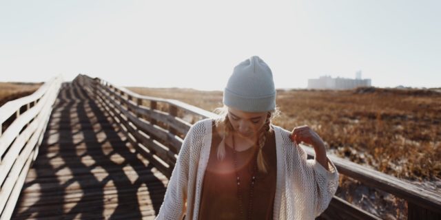 woman walking on bridge