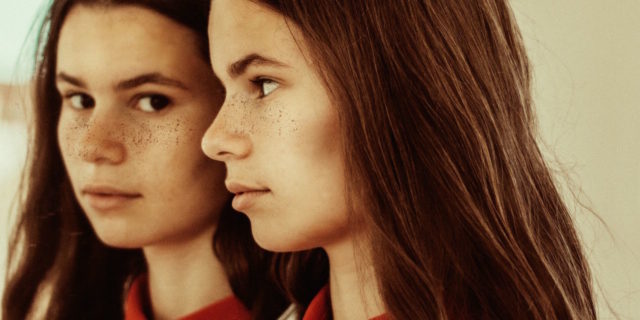 A Big Myth About Childhood Abuse A woman and her reflection in the mirror