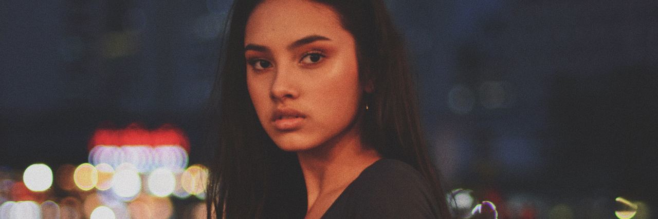 How Accepting Mistakes in Mental Health Recovery Is Important photo of southeast asian woman looking at camera with serious expression