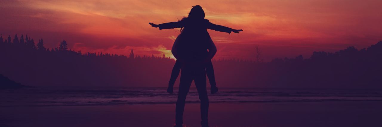 Illness Doesn't Make You a Burden, but You Still Need Help photo of two people silhouetted against sunset with one on the others' shoulders