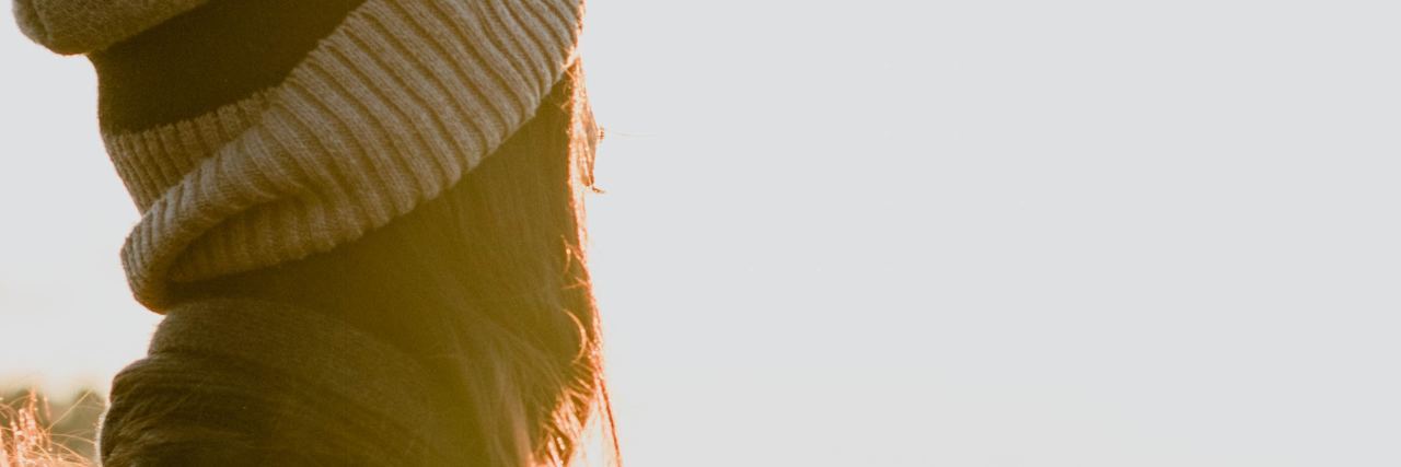 Transcranial Magnetic Stimulation for Treatment-Resistant Depression photo of woman in sunlight wearing hat