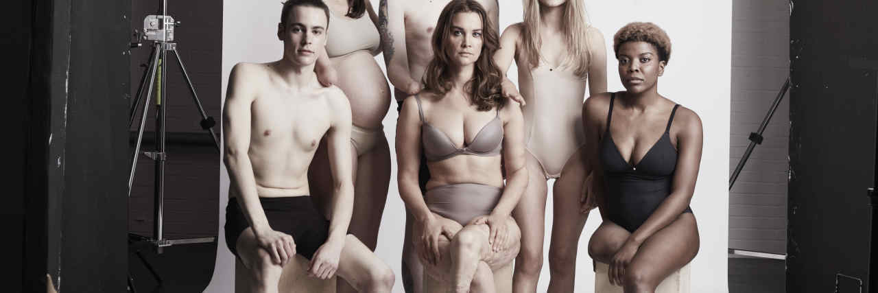 Models Showcase the Beauty of Limb Differences Models with limb differences posing in a group.