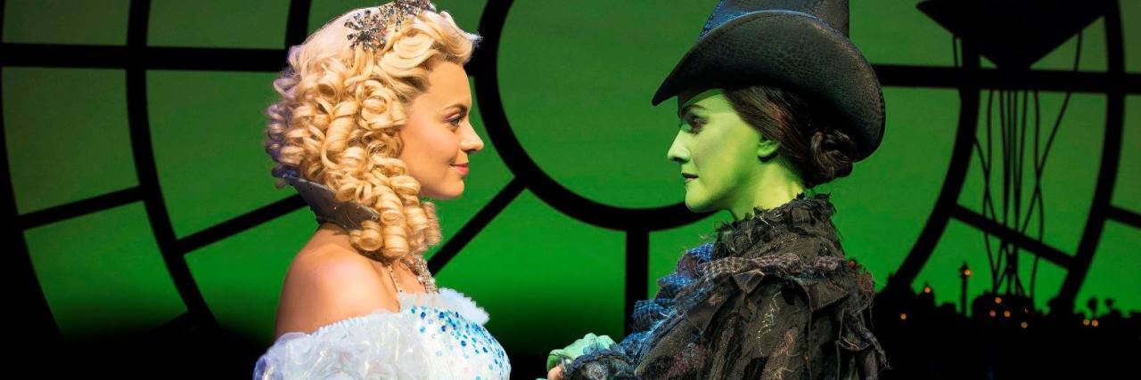 Why I Relate to ‘Defying Gravity’ From Wicked as a Person With Anorexia photo of characters from wicked facing each other and holding hands