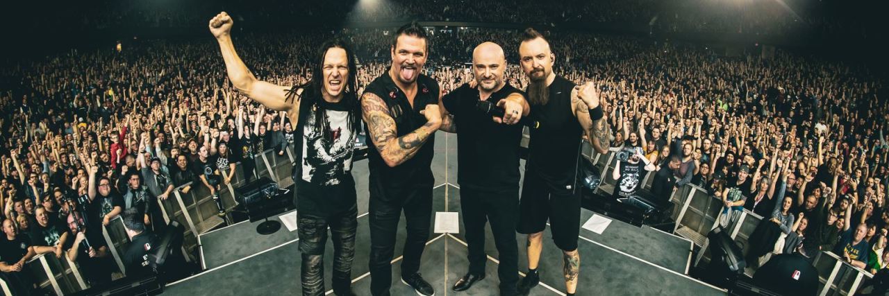 Disturbed Advocates for Mental Health In 'A Reason to Fight' Video Four members of the rock band Disturbed onstage during a live concert