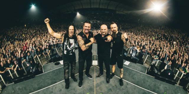 Disturbed's 'A Reason to Fight' Music Video Highlights the Reality of Living With Suicidal Thoughts Four members of the rock band Disturbed onstage during a live concert