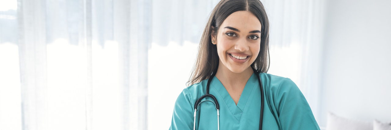 Letter to Senator Maureen Walsh About Her Nurse Comments A nurse smiling with her hands crossed