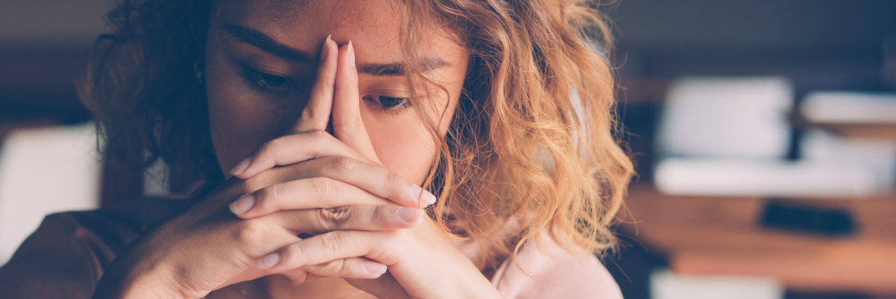 Comments That Diminish Chronic Pain Woman looks in pain or tired.