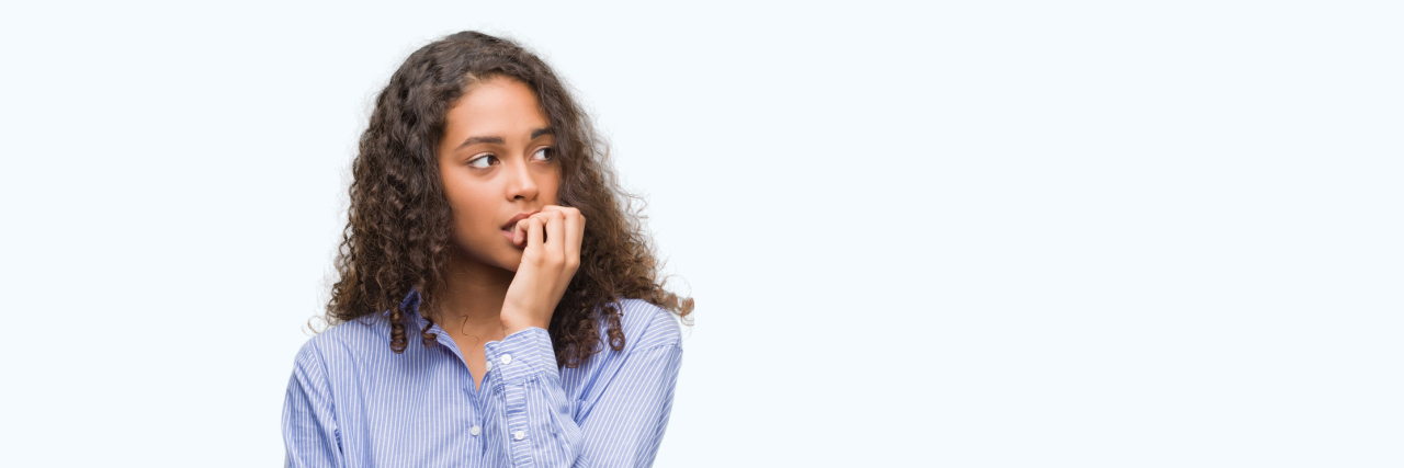 Woman biting her nails