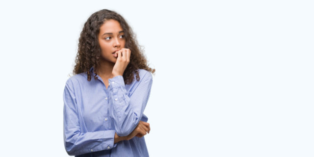 When Anxiety Makes It Hard to Enjoy Things  Woman biting her nails