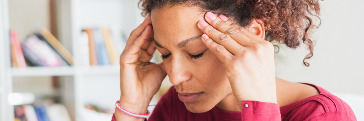 What Is Transient Aphasia and How Is It Related to Migraine With Aura? Young black woman suffering strong headache