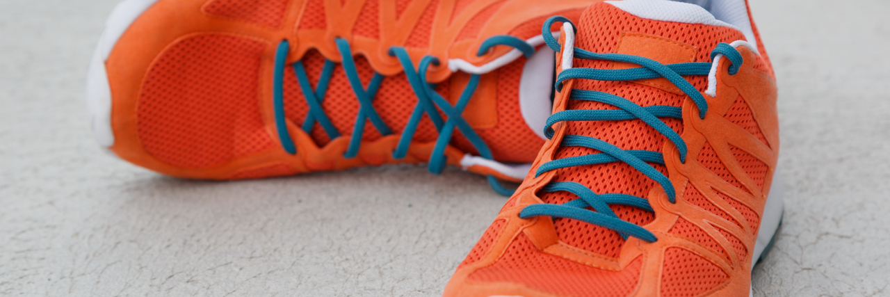 Wearing Out Shoes Because of Cerebral Palsy Orange shoes.