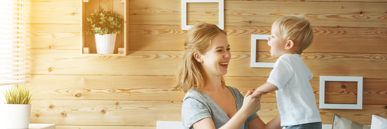 Moving Forward After Autism 'Diagnosis Day' Mother and son laughing and hugging.