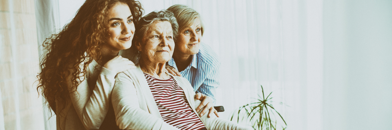 How Charcot-Marie-Tooth Disease Affects Multiple Generations A teenage girl with her mother and grandmother in wheelchair.
