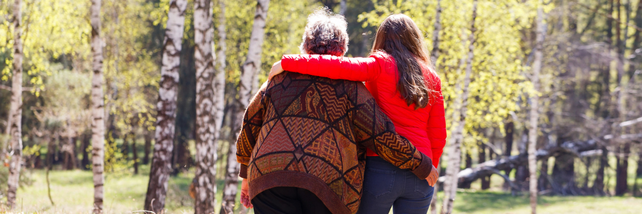 The Ideas That Worked for Me While Caring for My Mom With Alzheimer's Elderly woman walking in the park with her daughter