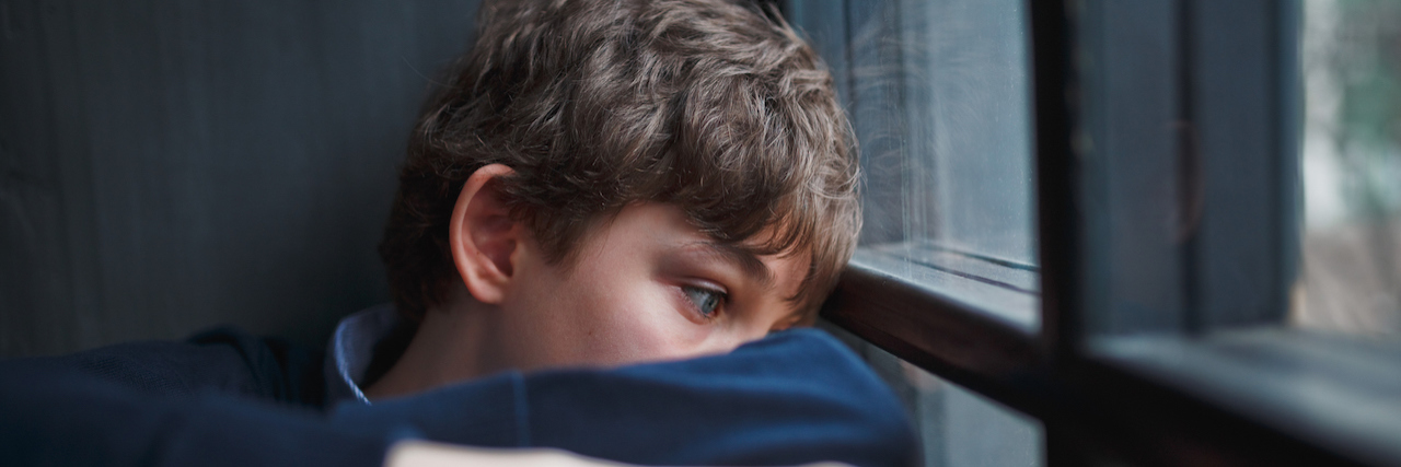 Childhood Sexual Abuse Is About More Than Touching A young man looking out a window