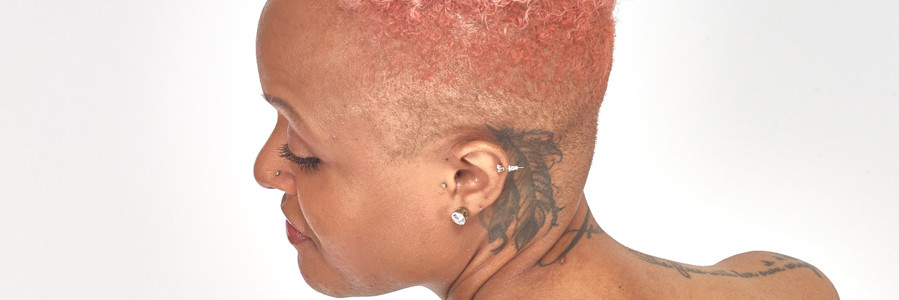 5 Misconceptions About Living With a Disability Keisha, African-American woman with pink hair and tattoos.