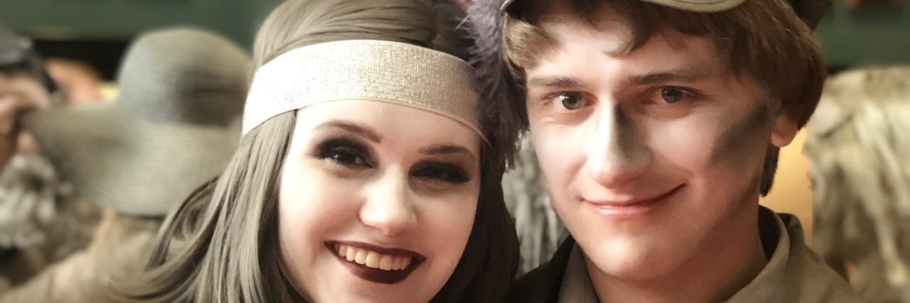 Never Say Never to My Autistic Son Ryan and friend wearing makeup for play and smiling at camera.