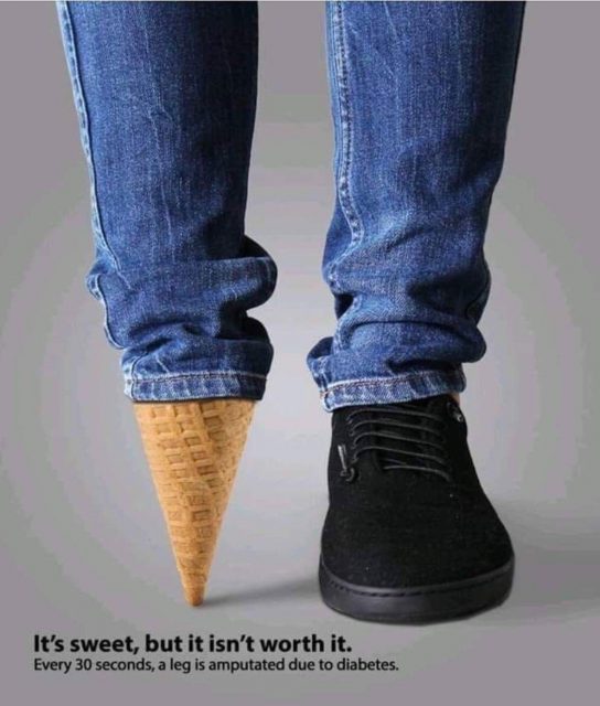 legs of person wearing jeans and one black shoe, the other foot is represented by an ice cream cone