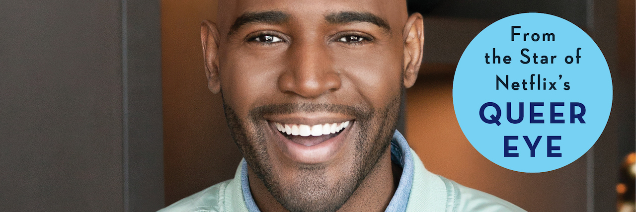 Excerpt From 'Karamo: My Story of Embracing Purpose' The cover of Karamo Brown's book, which is a photo of him reaching out his hand.
