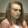 Image of Michelle Carter in court. She is a white woman with dirty blonde hair wearing a white shirt and light pink blazer.