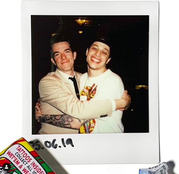 John Mulaney and Pete Davidson hugging in polaroid film photo dated 05.06.19