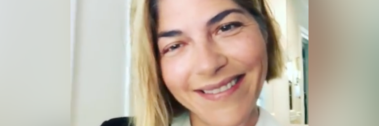 Selma Blair Shares 'Hack' for Applying Makeup With Multiple Sclerosis Selma Blair smiling during makeup "tutorial"