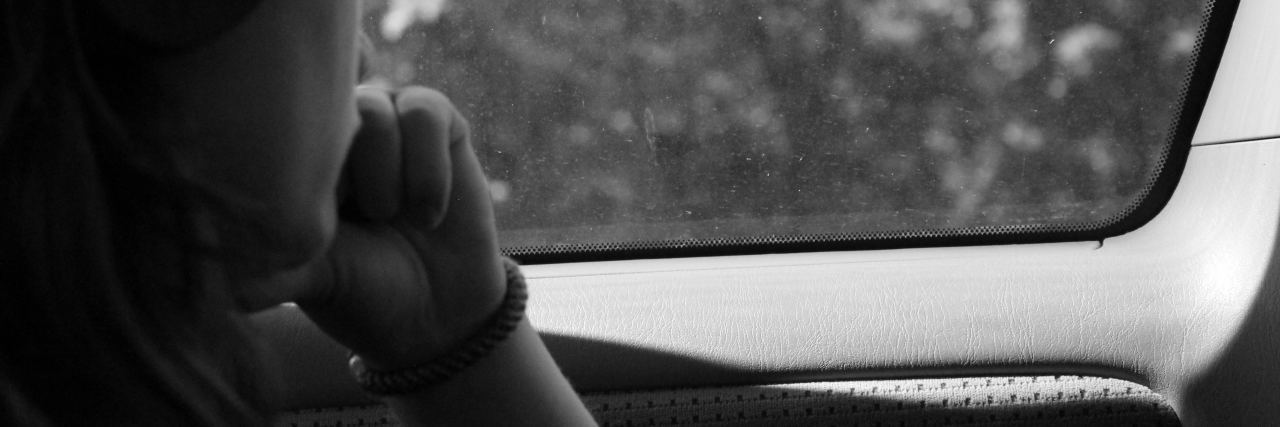 How Residential Treatment for My Mental Health Felt Like Home black and white photo of thoughtful young woman staring out of window wearing headphones