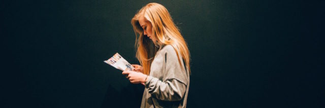 A woman looking at a magazine