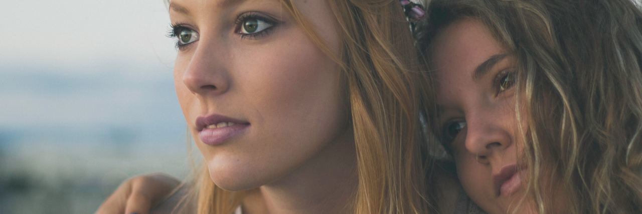 How to Have a Strong Relationship With a Friend With Borderline photo of two women watching sunset or sunrise together