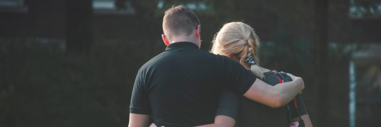 How to Deal With a Loved One Having Cancer man and woman with arms around each other