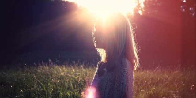 My 'VIP' Approach to Beating Rectal Cancer woman outside in field with sun flare behind her