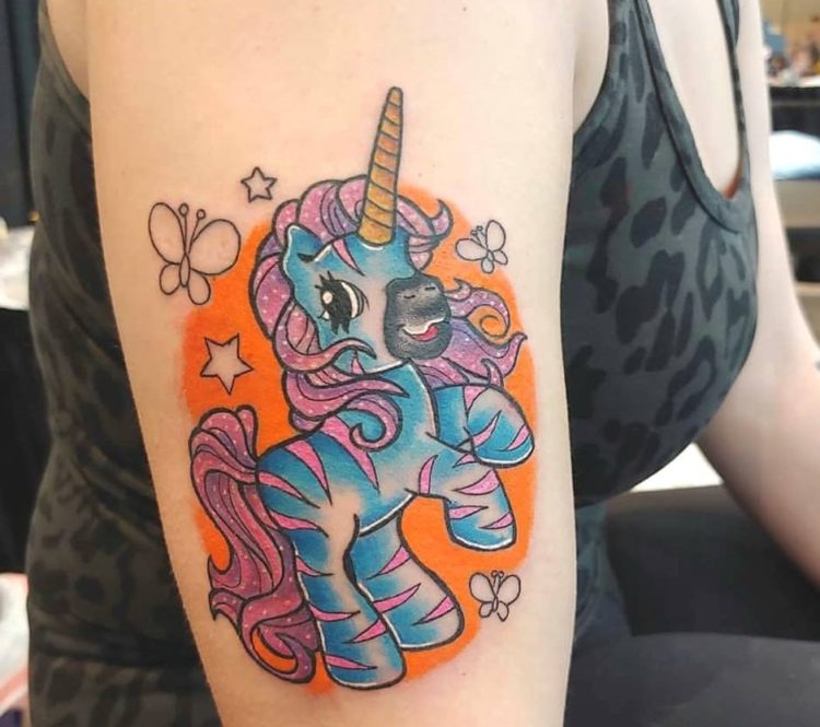 Chelsea J. Unicorn Zebra tattoo