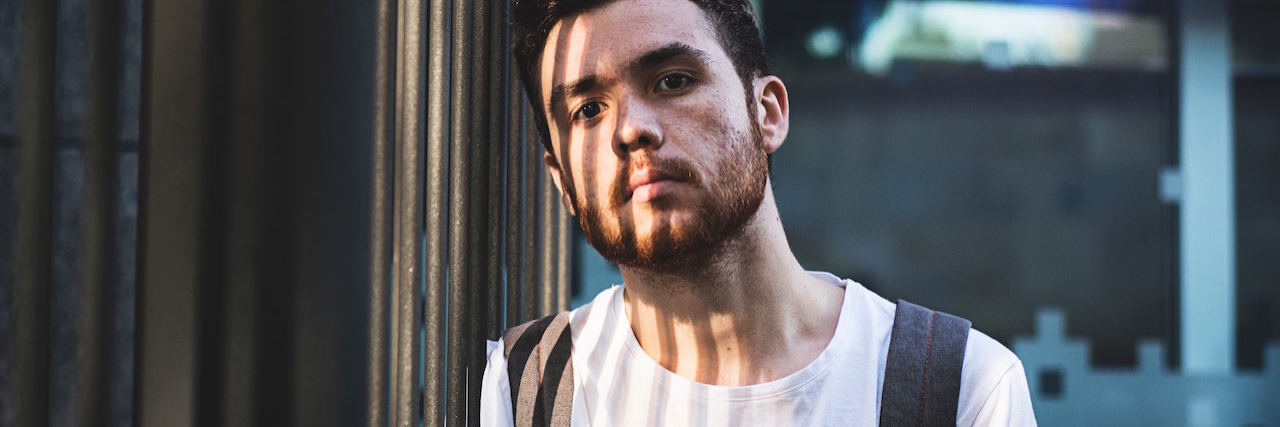 Differing Opinions About Using Medication to Mangage Psychosis A man wearing a backpack